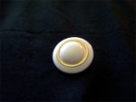 Gold-ring-surrounding-the-white-center-surrounded-by-a-white-rim-